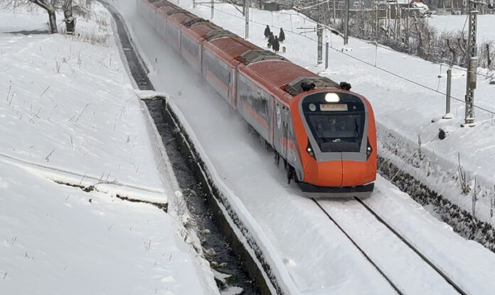 Train services operate smoothly on snow covered Railway track at Qazigund. —Excelsior/Sajad Dar