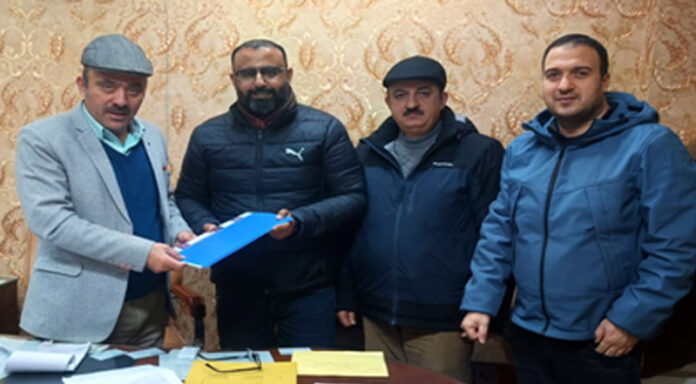 Dignitaries of JKDFC exchanging documents after inking MoU with Eicher Trucks & Buses.