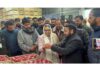 Dr Syed Darakhshan Andrabi assessing the condition of the apple crop at a cold storage facility in Lassipora on Friday.
