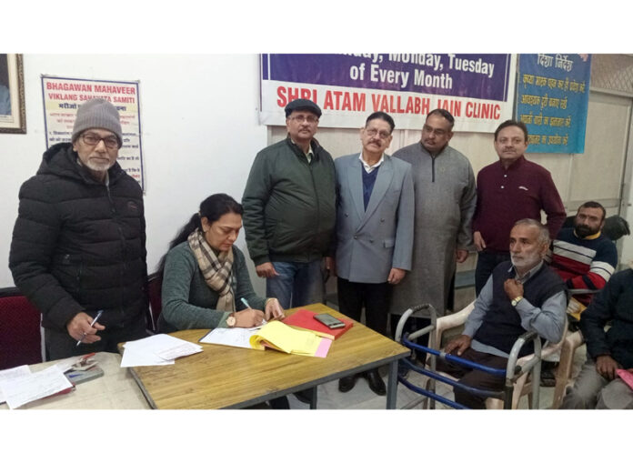 Doctors, beneficiaries and others at the starting of free artificial limbs camp in Jammu on Sunday.