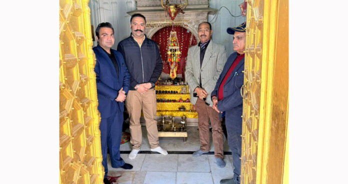 J&K Dharmarth Trust Trustee, Ranvijay Singh and others at a temple of the Trust.