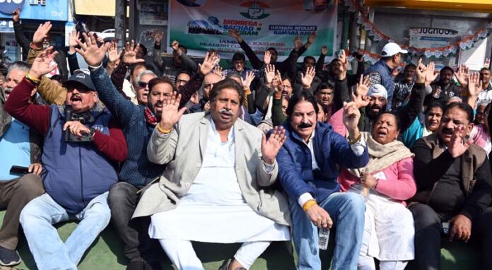 Congress leaders Raman Bhalla, Yogesh Sawhney and others during a sit-in protest at New Plot, Jammu. Congress leaders Raman Bhalla, Yogesh Sawhney and others during a sit-in protest at New Plot, Jammu.