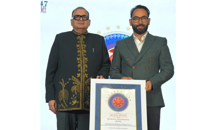 Municipal Commissioner Dharamshala, Zaffar Iqbal, posing with a dignitary after receiving 'SKOCH Award 2025'.