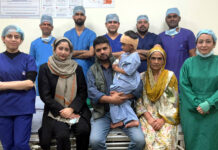 Narayana Hospital performs landmark cochlear implant surgery using Kanso 3 A team of doctors posing with a child and his parents after performing a landmark cochlear implant surgery on him at SMVD Narayana Hospital, Katra.