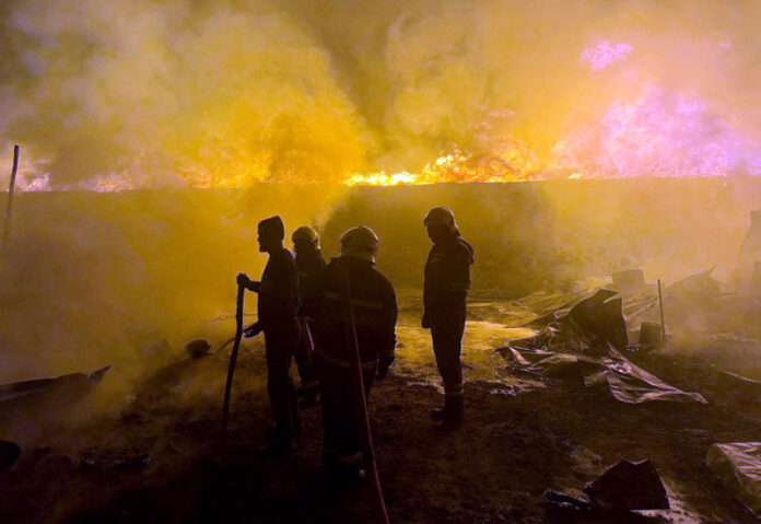 A view of blaze in Srinagar’s Tengpora area on Tuesday evening. — Excelsior/Shakeel