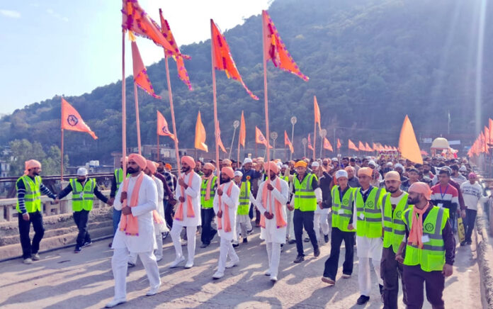Guru Ravidas Sabha members taking out religious procession in Rajouri on Thursday. -Excelsior/ Imran.