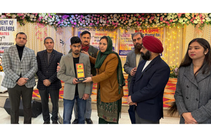 Minister Sakeena Itoo honouring visually impaired child in Jammu on Sunday.