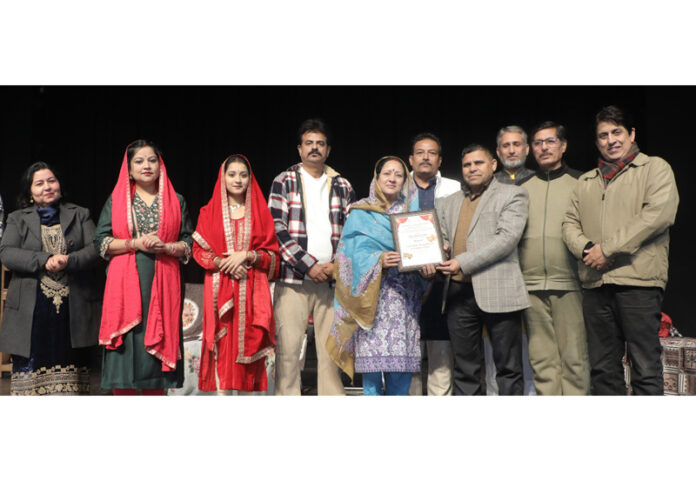 Additional Secretary JKAACL Lal Chand handing over memento to a member of theatre group. Additional Secretary JKAACL Lal Chand handing over memento to a member of theatre group.