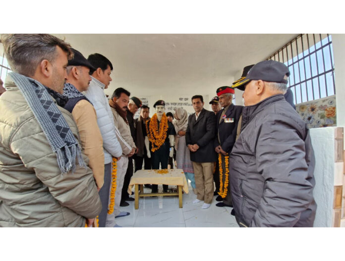 MLA Jasrota, Rajiv Jasrotia paying tribute to martyr Mangal Singh at village Ladoli in Kathua district on Monday.