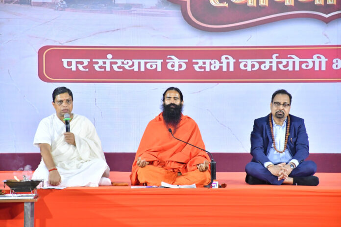 Patanjali Yogpeeth Trust president, Swami Ramdev and others addressing a gathering during the celebration of 32nd foundation day of the Trust in Haridwar on Monday. Patanjali Yogpeeth Trust president, Swami Ramdev and others addressing a gathering during the celebration of 32nd foundation day of the Trust in Haridwar on Monday.