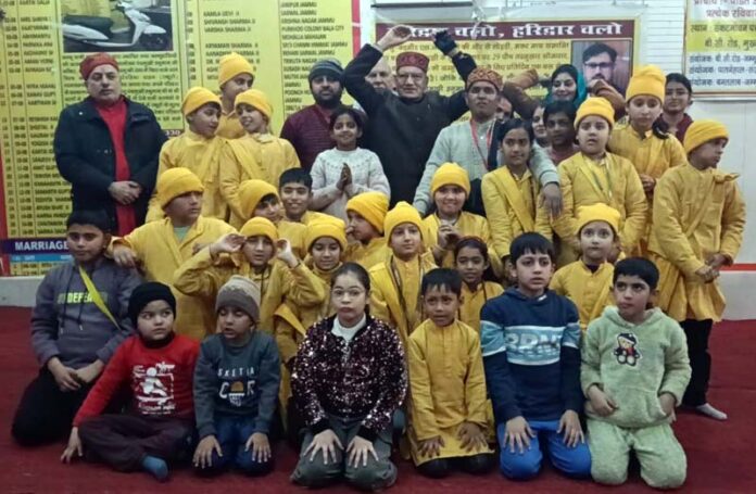 Pawan Kumar Shastri posing along with the students during a function in Jammu.