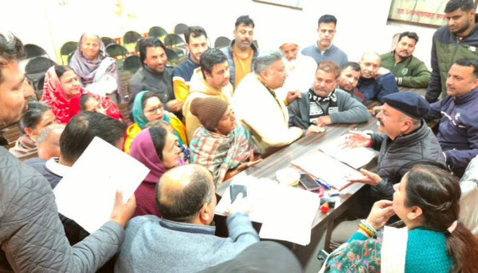 MLA Jammu East, Yudhvir Sethi listening people's grievances at a public darbar at Jammu on Thursday.