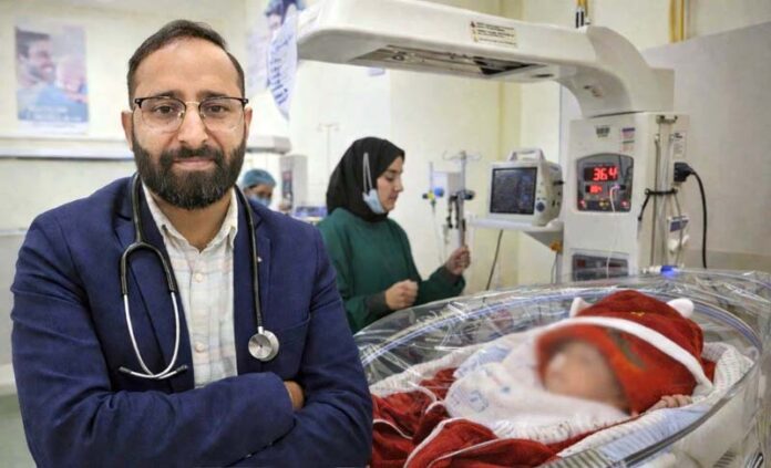 Dr Sanjeet Singh with a critically ill newborn child at NICU in SMVD Narayana Superspeciality Hospital, Katra.