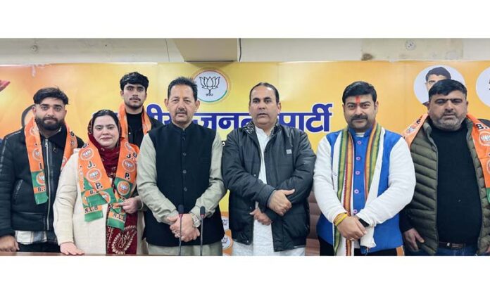 BJP leaders taking new entrants into party fold at Jammu on Monday.