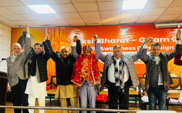 BJP leaders taking new entrants into party fold at Jammu on Thursday.