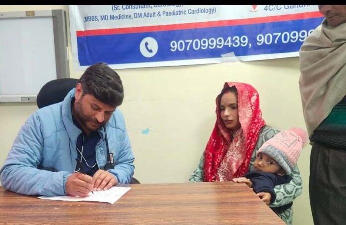 A doctor providing consultation to a patient during a paediatric cardiology camp at SMVD Narayana Multispeciality Clinic, Gandhi Nagar, Jammu.