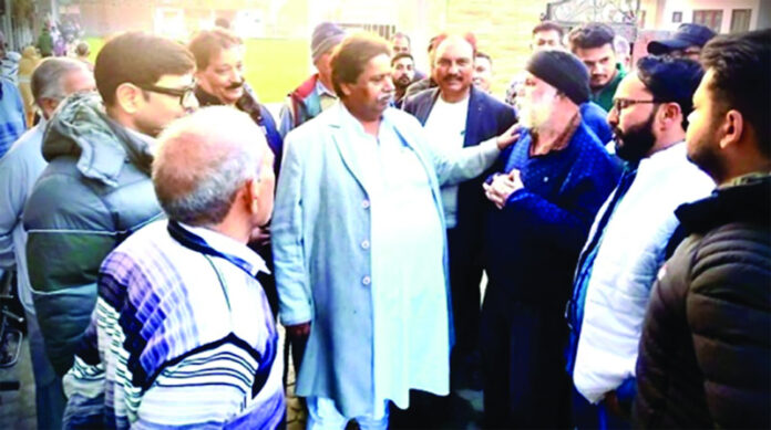 Senior Cong leader Raman Bhalla interacting with people at Bhour Kullian in Jammu South.