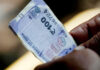 Rupee falls 14 paise to close  at 90.70 against US dollar