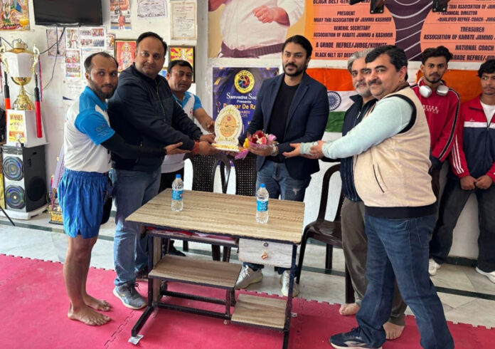 Organisers presenting memento to dignitary.