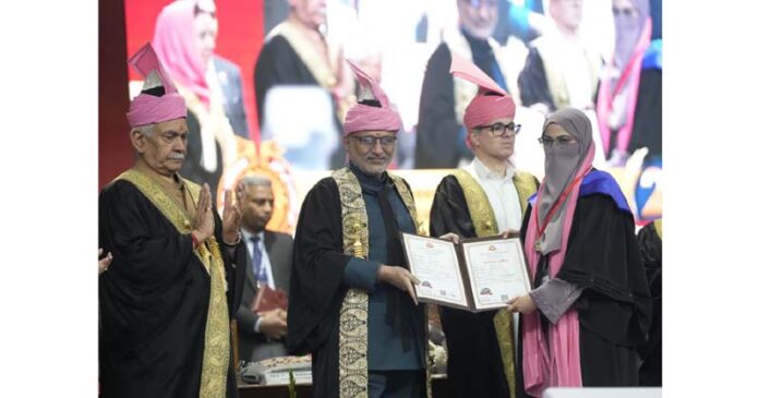 Vice President CP Radhakrishnan gives degree to a student during KU convocation in Srinagar on Thursday. Vice President CP Radhakrishnan gives degree to a student during KU convocation in Srinagar on Thursday.