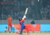 DC player hitting shot during match against Gujarat Giants.