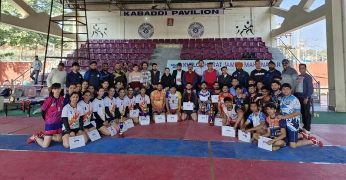 Kabaddi players posing along with certificates during prize distribution ceremony.