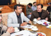 Div Com Kashmir chairing a meeting on Saturday.