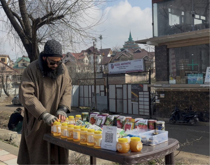 Visually impaired Abid Ahmad Dhar at his stall in Srinagar. —Excelsior/Mohd Saqib