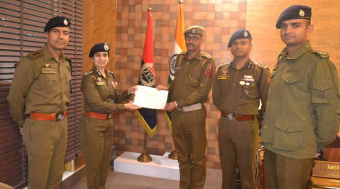 DIG UR Range Sarah Rizvi felicitating an IO in Udhampur District on Saturday.