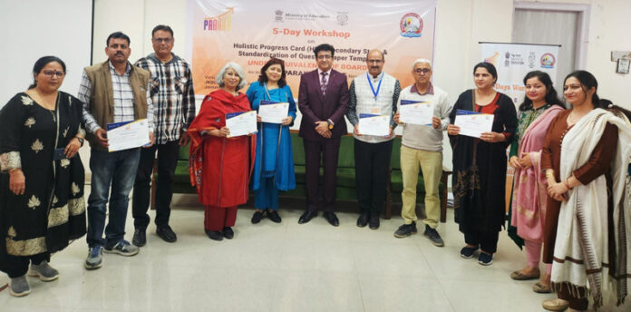Participants displaying certificates awarded to them during valedictory session of workshop by JKBOSE.