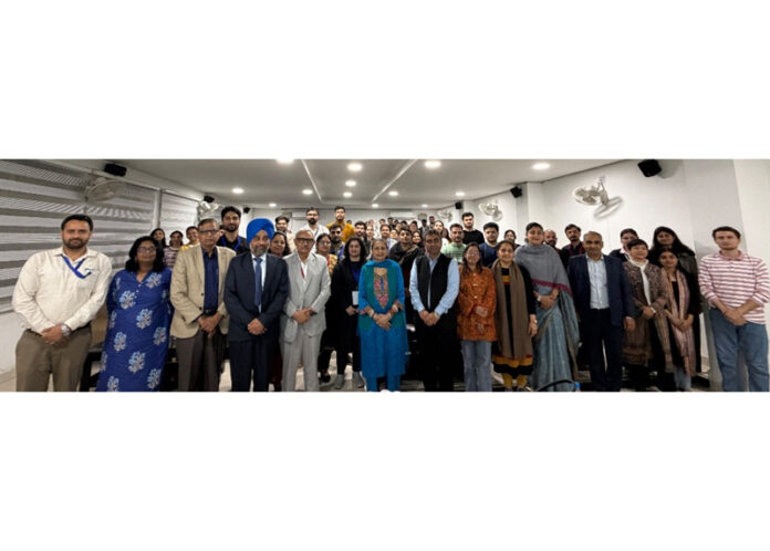 Dignitaries posing for a group photograph during a function at JU.