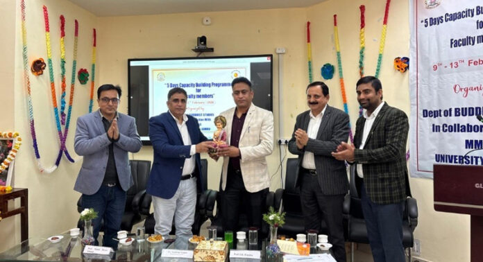 HoD Buddhist Studies presenting memento to Regional Director IGNOU during valedictory function.