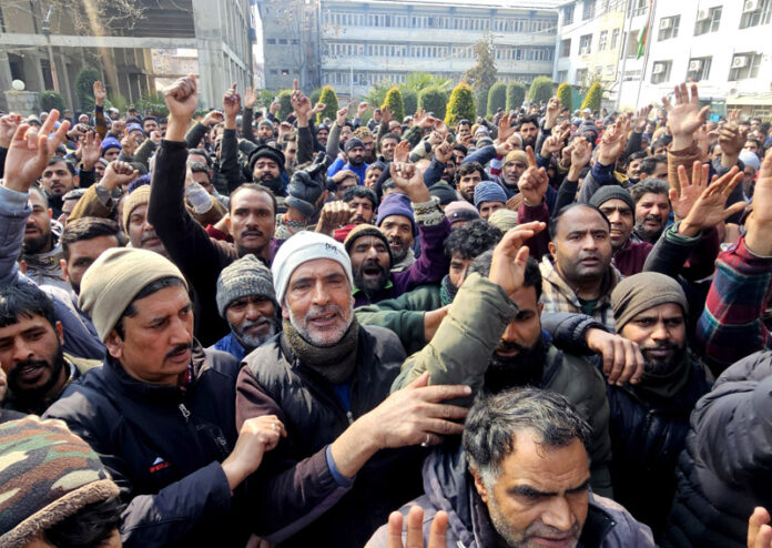 SMC employees during a protest in Srinagar on Saturday. -Excelsior/Shakeel SMC employees during a protest in Srinagar on Saturday. -Excelsior/Shakeel