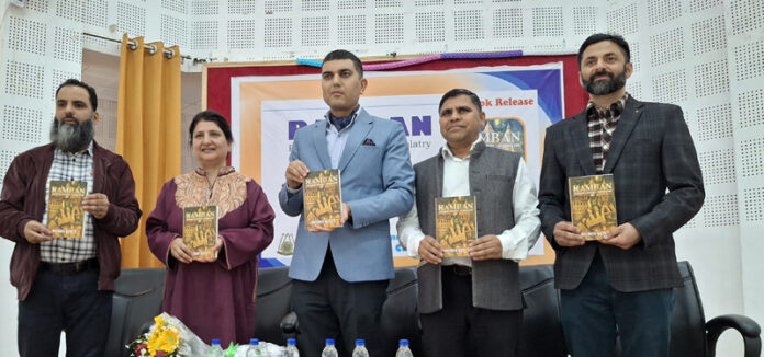 MLA Ramban, Arjun Singh Raju, along with others releasing a book in Jammu.