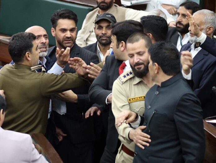 Watch and Ward staff preventing PDP and NC members from clash in Assembly on Monday.