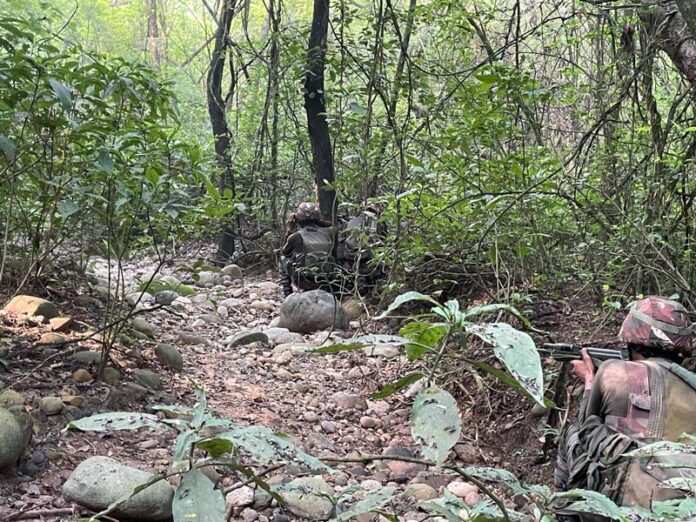Security forces conducting searches in Sunderbani on Friday. —Excelsior/Imran Security forces conducting searches in Sunderbani on Friday. —Excelsior/Imran