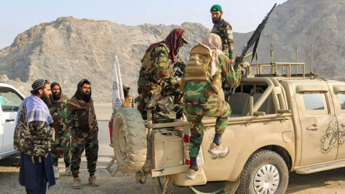 Taliban soldiers carry weapons in a vehicle, near Torkham border in Afghanistan. Taliban soldiers carry weapons in a vehicle, near Torkham border in Afghanistan.