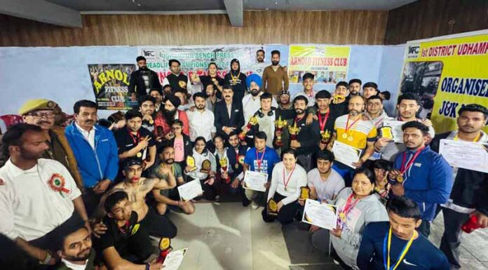 Medal winners posing along with dignitaries.