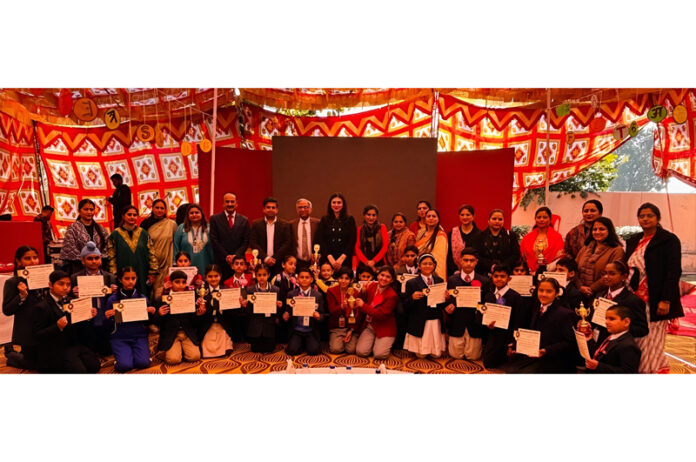 Students displaying certificates during a programme.