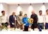 Dignitaries honouring Asia Cup Gold Medalist Aneesha Sharma during a programme.