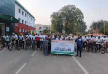 SAI, ESIC organize FIT India Cycling rally in Jammu Participants posing for a group photograph.