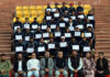 Participants posing with their certificates alongside dignitaries during valedictory ceremony of Inter-State Youth Exchange Programme in Jammu.
