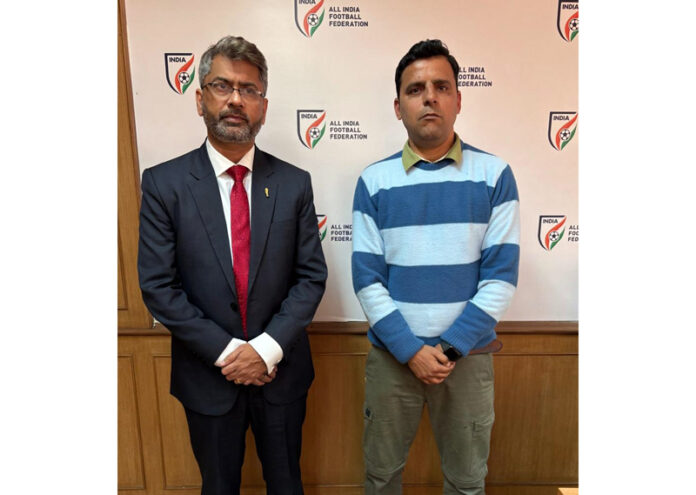 Arun Malhotra posing with AIFF President Kalyan Chaubey.
