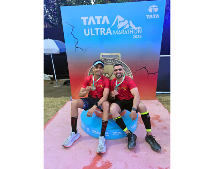 Iron Tribe athletes posing along with medals.