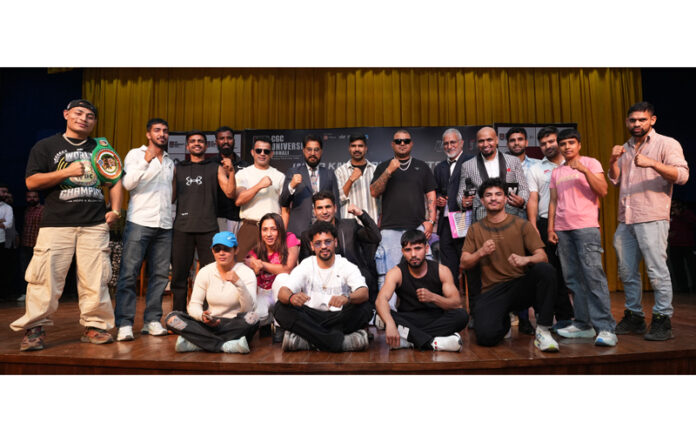 Professional boxers posing along with organisers.