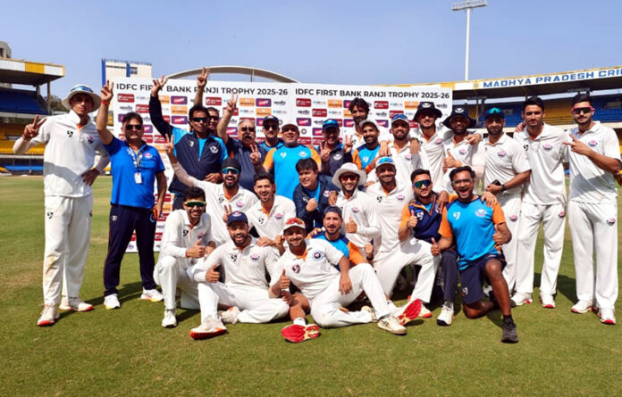 Winning team posing for group photograph.