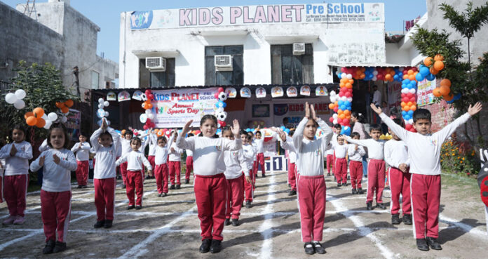 Students performing Yoga during Annual Day Sports of Kids Planet Pre School, Jammu.
