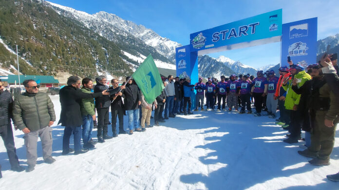 Syed Qamar Sajad, Director Tourism Kashmir flagging off 10th National SnowShoe Championship in Sonamarg. -(Excelsior/Firdous Ahmed)