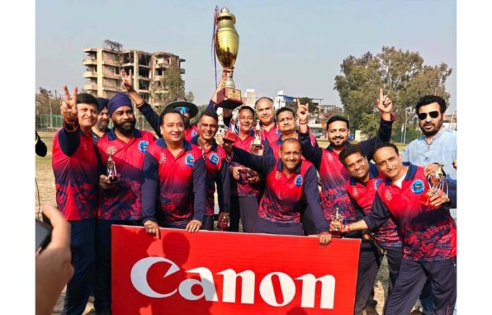 Winning team posing along with trophy. Winning team posing along with trophy.