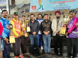 Dignitaries posing along with winners during closing ceremony.